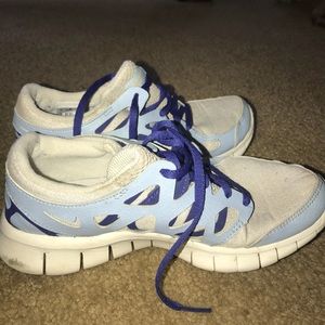 Blue themed Nike sneakers.